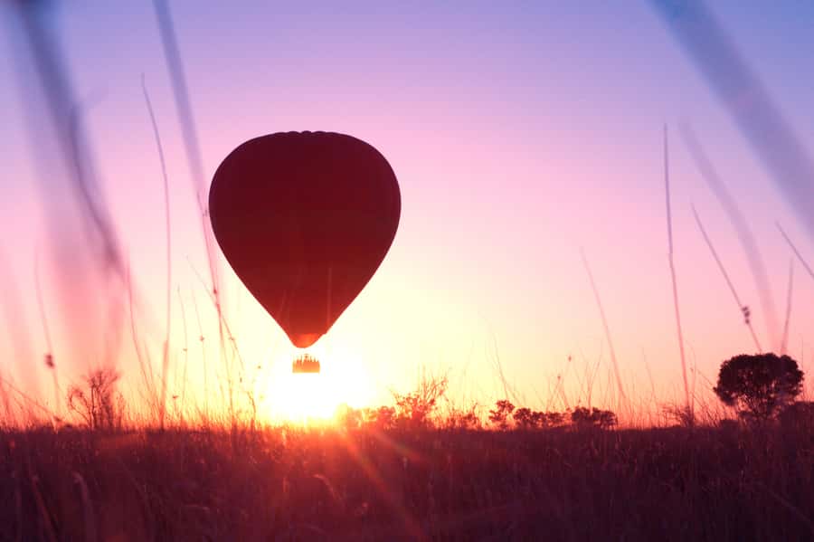 Alice Springs: Early Morning Hot Air Balloon Flight - Landing day feels like part flight, part festival